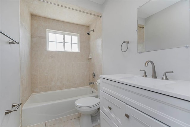 bathroom with toilet, tile patterned flooring, vanity, and shower / bathing tub combination