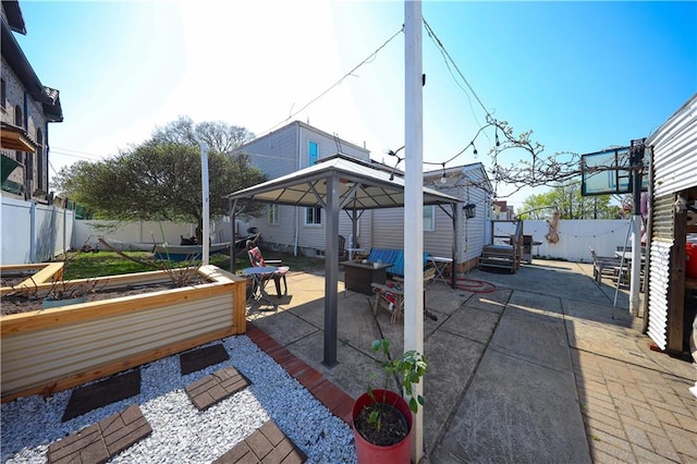 view of patio / terrace with a gazebo and a fenced backyard
