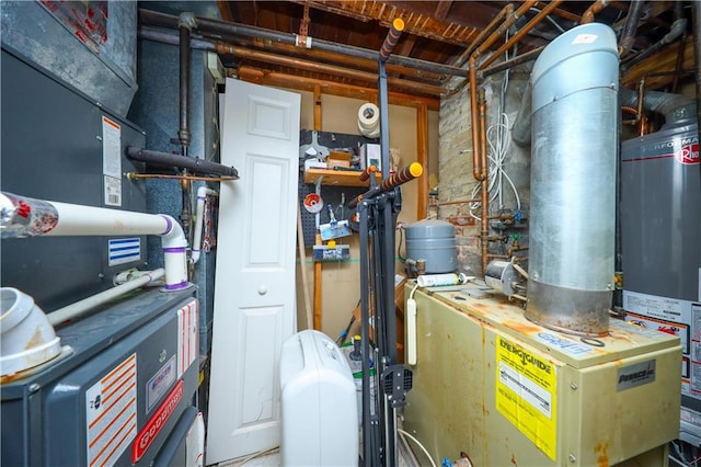 utility room with heating unit and water heater