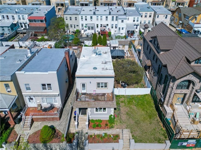 birds eye view of property with a residential view