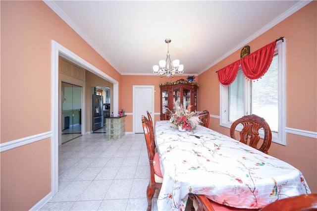dining room featuring ornamental molding, an inviting chandelier, and light tile patterned floors