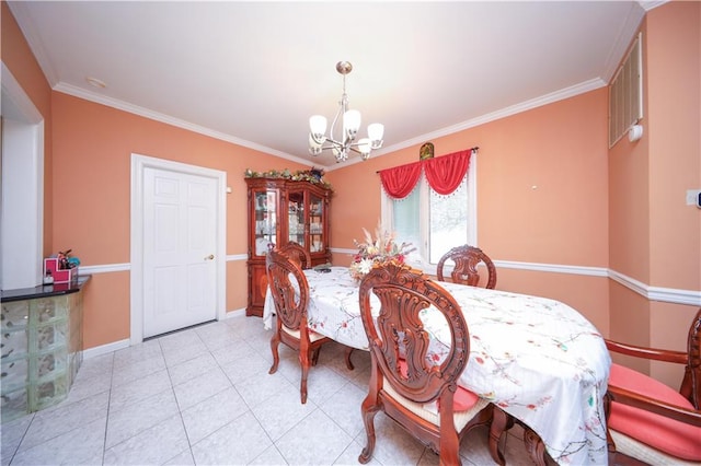 dining space with a chandelier, baseboards, and ornamental molding