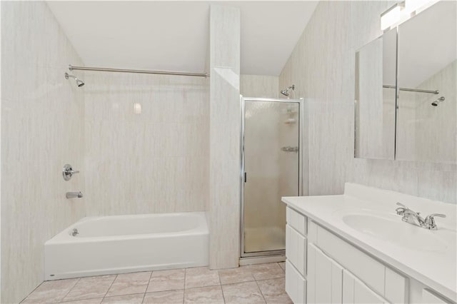 full bathroom featuring tile walls, bath / shower combo with glass door, tile patterned flooring, and vanity