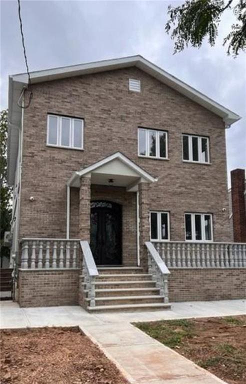 view of front facade featuring brick siding