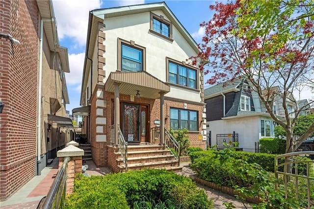 1639 Hendrickson St, Brooklyn, NY 11234 - view of front of house with stucco siding and brick siding
