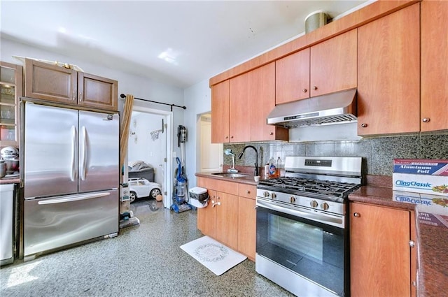 1639 Hendrickson St, Brooklyn, NY 11234 - kitchen with stainless steel appliances, under cabinet range hood, decorative backsplash, and a sink