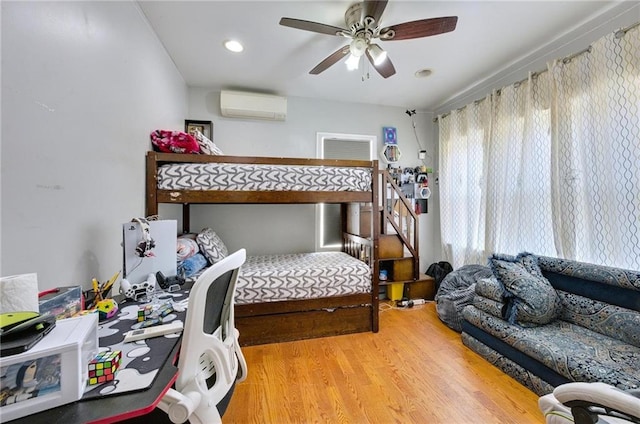 1639 Hendrickson St, Brooklyn, NY 11234 - bedroom with wood finished floors, a wall unit AC, a ceiling fan, and recessed lighting