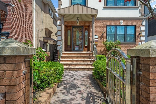 1639 Hendrickson St, Brooklyn, NY 11234 - entrance to property with brick siding, a gate, and stucco siding