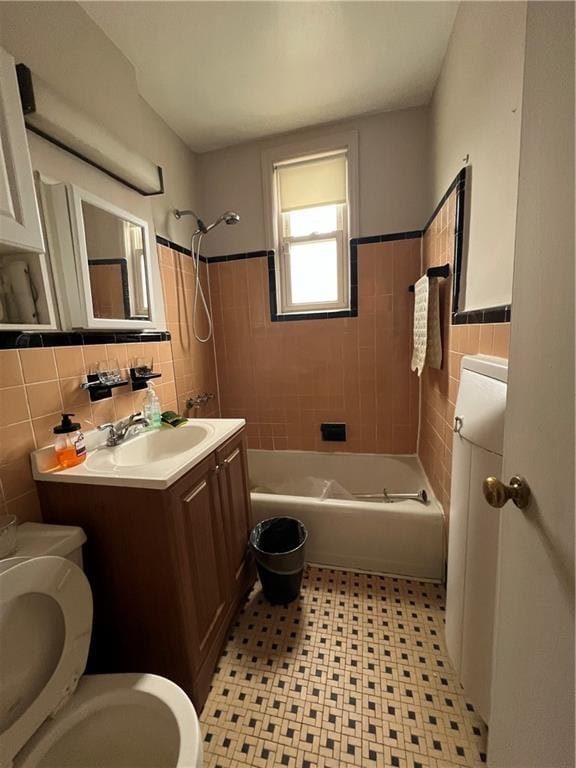 1774 E 54th St Unit 13B, Brooklyn, NY 11234 - full bath with toilet, tile walls, vanity, washtub / shower combination, and tile patterned floors