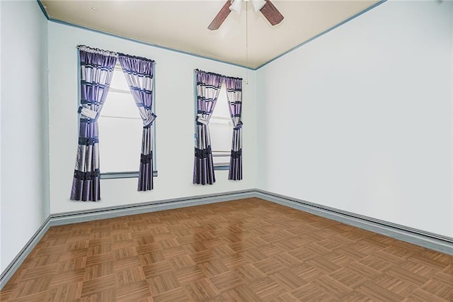 empty room with baseboards and ceiling fan