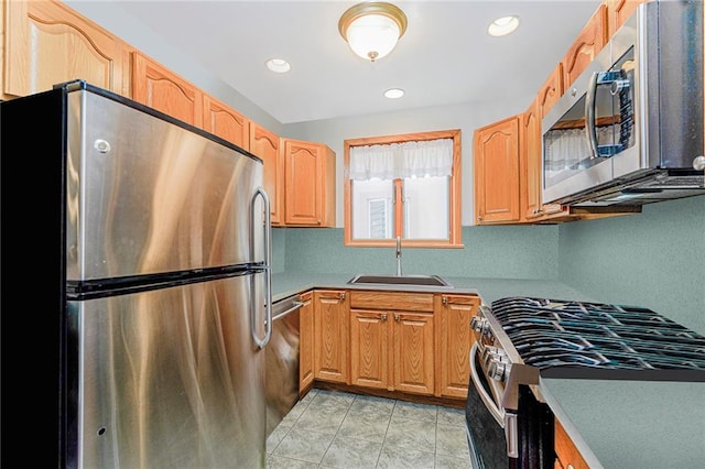 kitchen featuring recessed lighting, appliances with stainless steel finishes, and a sink
