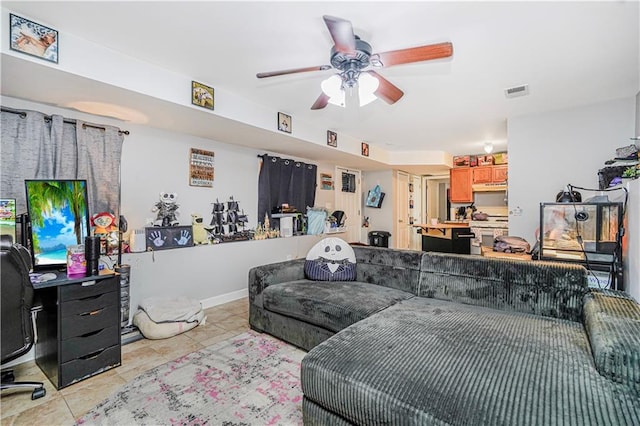 living area with light tile patterned floors, ceiling fan, and visible vents