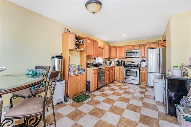 kitchen with open shelves, light countertops, stainless steel appliances, light tile patterned floors, and tasteful backsplash