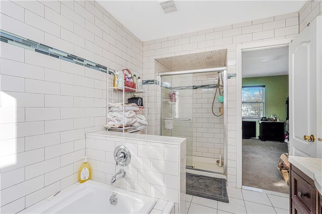 full bath featuring a garden tub, vanity, visible vents, and a shower stall