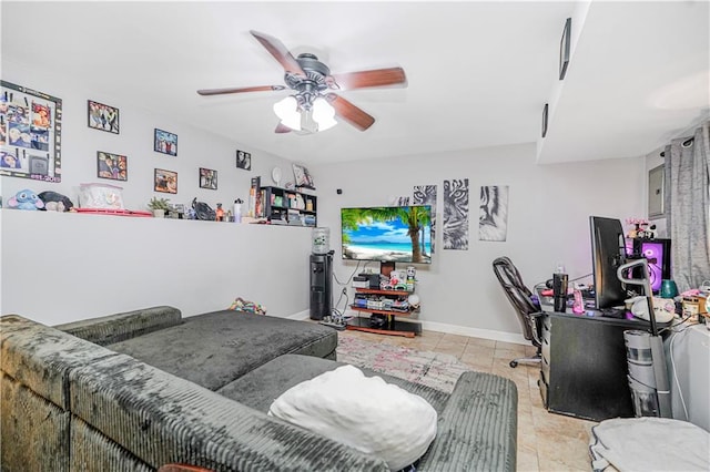 tiled living room featuring baseboards and ceiling fan