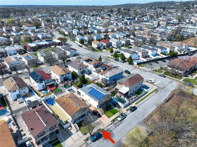 aerial view of property's location with nearby suburban area