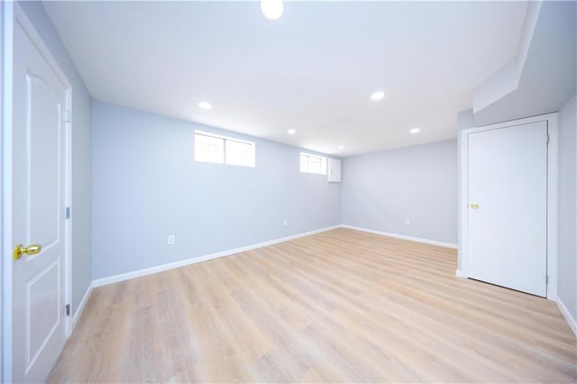basement with light wood-style floors, baseboards, and recessed lighting