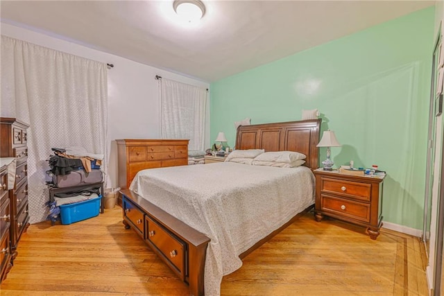 bedroom with light wood-type flooring