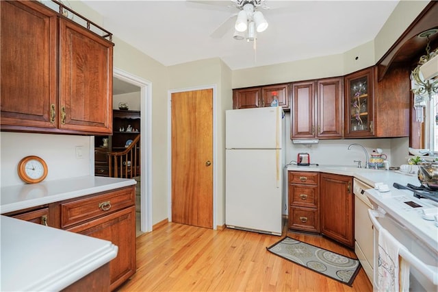 249 Slosson Ave, Staten Island, NY 10314 - kitchen with light wood finished floors, light countertops, a sink, and white appliances