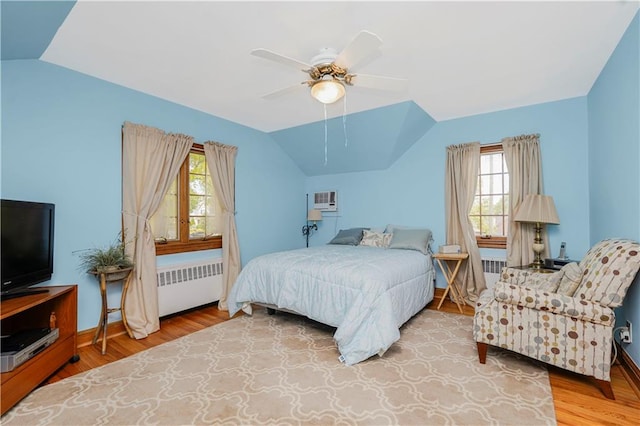 249 Slosson Ave, Staten Island, NY 10314 - bedroom featuring radiator, multiple windows, and vaulted ceiling