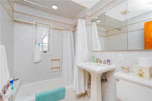 249 Slosson Ave, Staten Island, NY 10314 - full bathroom featuring tile walls, toilet, visible vents, and shower / tub combo with curtain