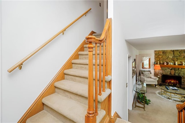 249 Slosson Ave, Staten Island, NY 10314 - staircase featuring carpet and a stone fireplace
