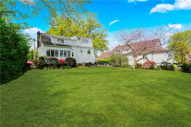 249 Slosson Ave, Staten Island, NY 10314 - back of property featuring a yard and a chimney