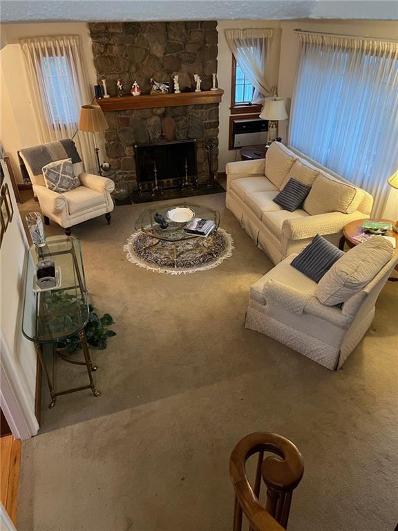 249 Slosson Ave, Staten Island, NY 10314 - living area featuring carpet flooring and a stone fireplace