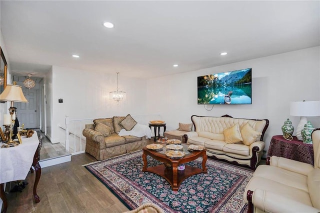 living room with recessed lighting, wood finished floors, and a chandelier