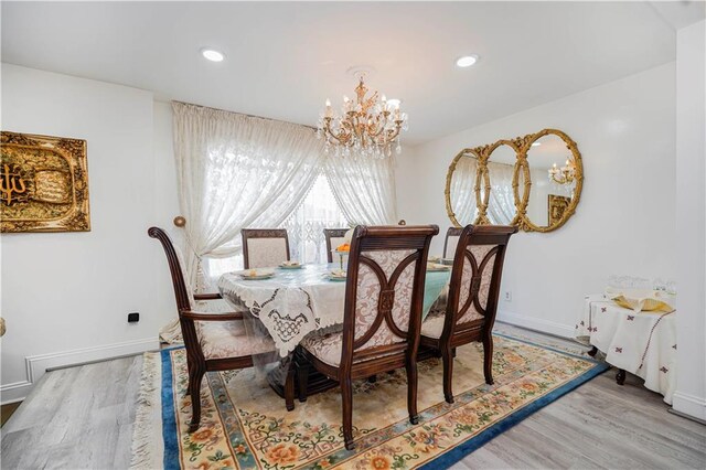 149 Forest St, Staten Island, NY 10314 - dining room with a chandelier, wood finished floors, baseboards, and recessed lighting