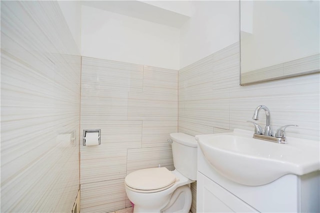 149 Forest St, Staten Island, NY 10314 - half bathroom with tile walls, toilet, and vanity