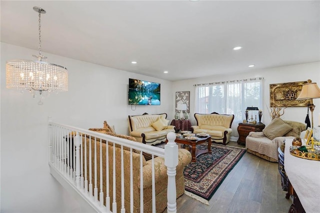 living area with an inviting chandelier, recessed lighting, and wood finished floors