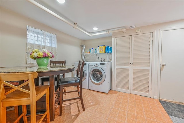 washroom with recessed lighting and washer and clothes dryer