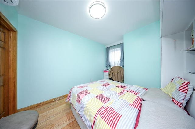 bedroom with light wood-style floors