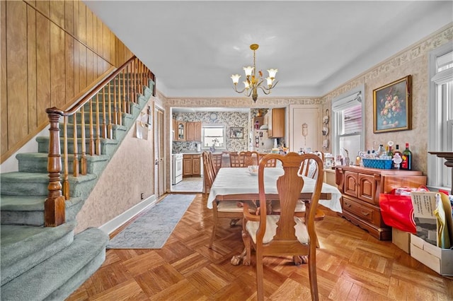 1462 E 65th St, Brooklyn, NY 11234 - dining area featuring wallpapered walls, stairs, a chandelier, and healthy amount of natural light