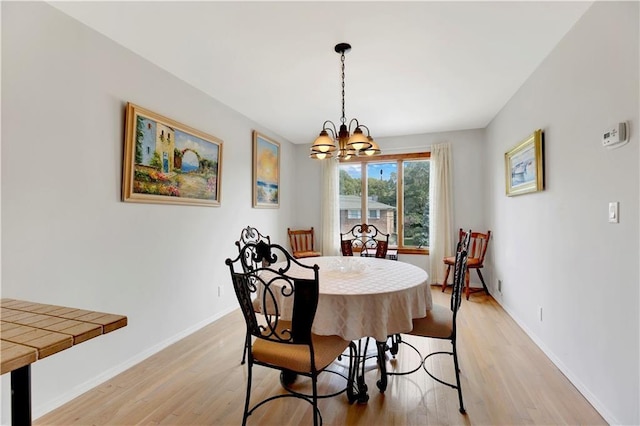 30 Beverly Rd, Staten Island, NY 10305 - dining area featuring a chandelier and light wood-style floors