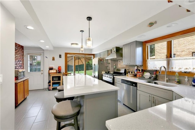 30 Beverly Rd, Staten Island, NY 10305 - kitchen with appliances with stainless steel finishes, wall chimney exhaust hood, recessed lighting, a kitchen island, and tasteful backsplash