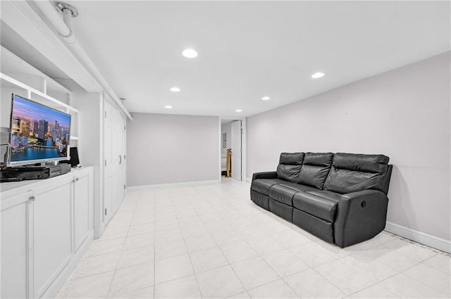 living room featuring baseboards and recessed lighting