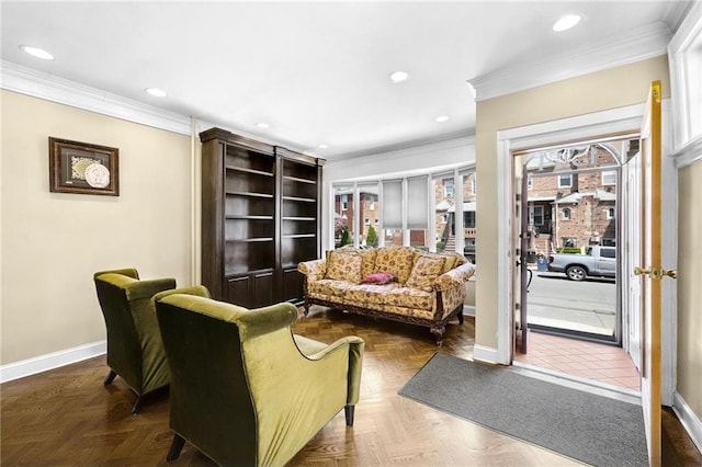 living area featuring crown molding, baseboards, and recessed lighting