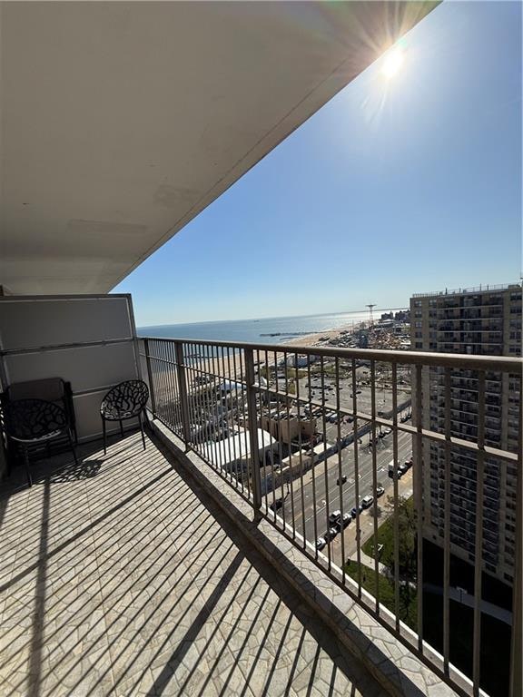 balcony featuring a water view