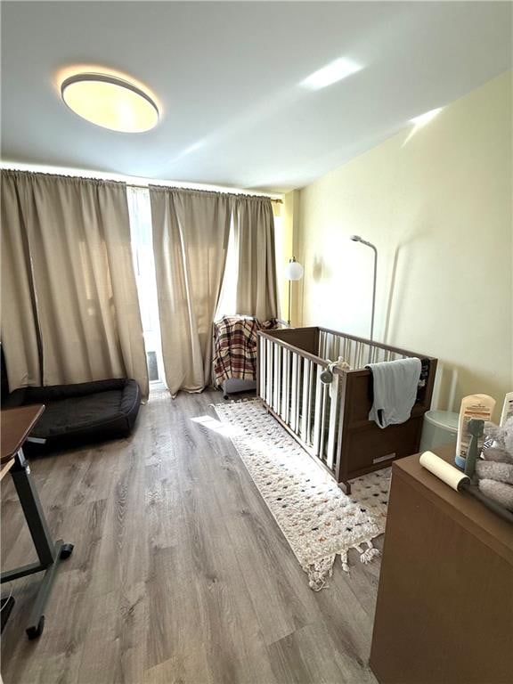 bedroom with wood finished floors