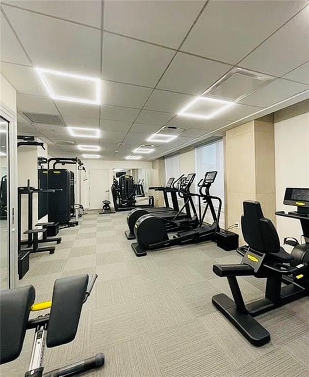 exercise room with light carpet