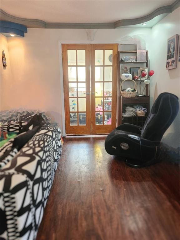 sitting room featuring french doors and wood finished floors
