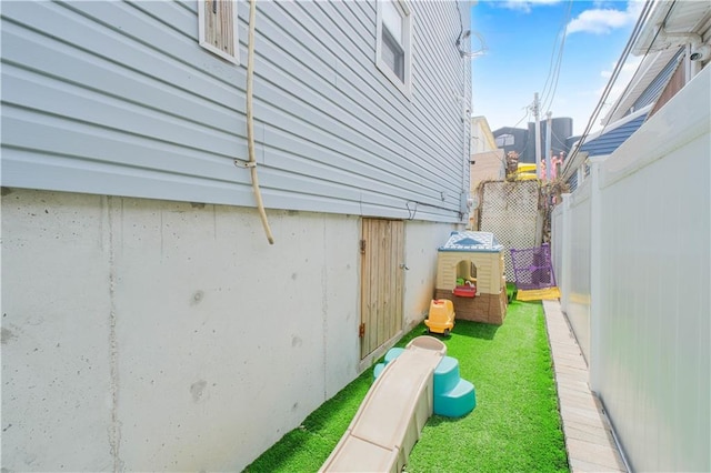 view of yard featuring fence