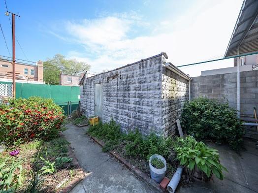 299 Bay 13th St, Brooklyn, NY 11214 - view of home's exterior with a fenced backyard
