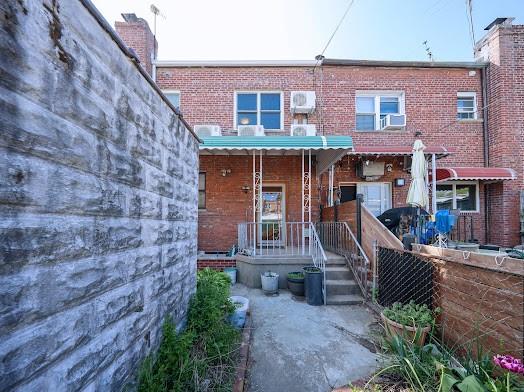 299 Bay 13th St, Brooklyn, NY 11214 - rear view of property featuring brick siding and cooling unit