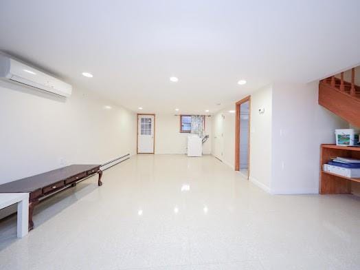 299 Bay 13th St, Brooklyn, NY 11214 - basement featuring a wall unit AC, recessed lighting, and stairs