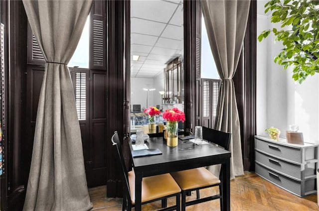 dining room featuring a paneled ceiling