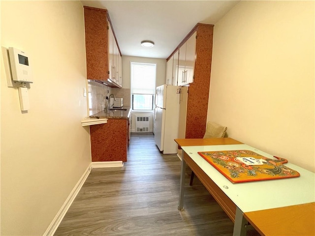 3101 Ocean Pkwy Unit 4O, Brooklyn, NY 11235 - corridor with dark wood finished floors, a sink, radiator, and baseboards