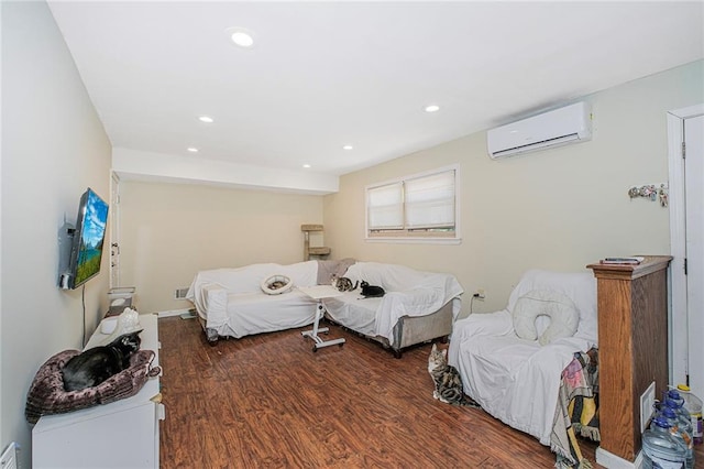 bedroom featuring wood finished floors, recessed lighting, and a wall mounted AC